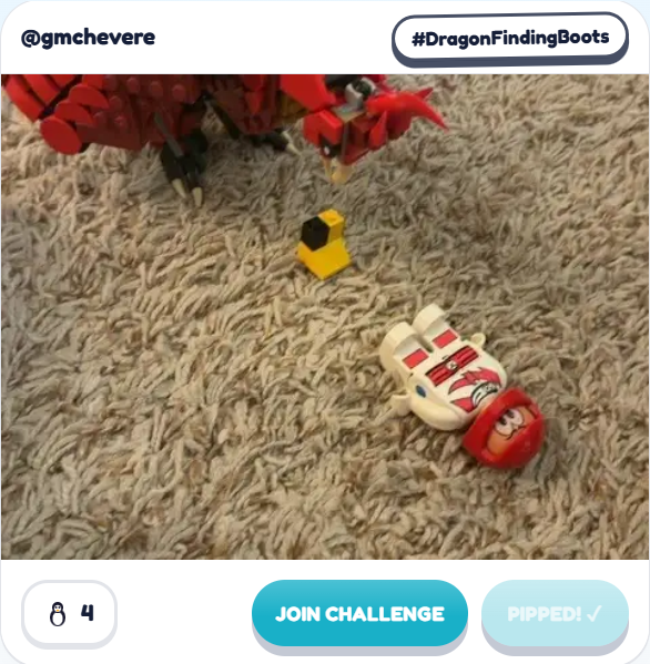 A Fast Brix! gallery build by @gmchevere for the #DragonFindingBoots prompt: a big red LEGO dragon looming over a tiny yellow boot on a carpet, with a fallen minifigure nearby.